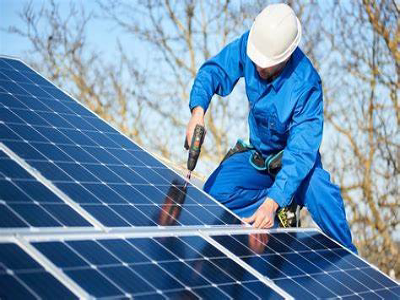 Person installing solar panels on a home